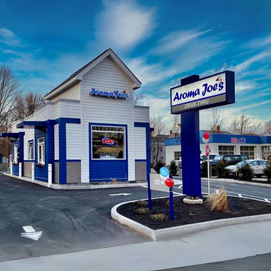 A picture of an aroma Joe's exterior with a prominent drive-through