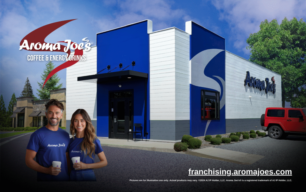 Promotional image of an Aroma Joe’s Coffee & Energy Drinks drive-thru location featuring blue and white exterior branding, two smiling team members holding beverages in front of the building, and the text “franchising.aromajoes.com.”